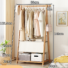 bambusowy-wieszak-z-torba-na-ubrania-i-polka-na-akcesoria-66-cm66a0d0829cc444ba9af610ef720e836a.png Bambusowy wieszak z torbą na ubrania i półką na akcesoria - 66 cm
